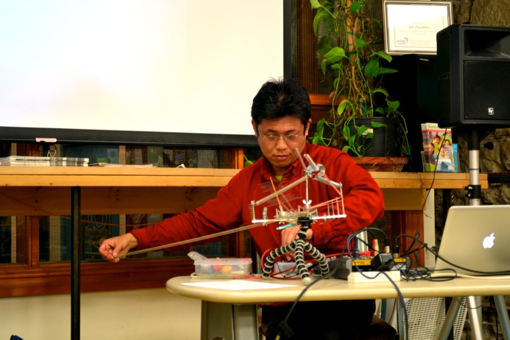 Adachi performs on a self-made instrument.